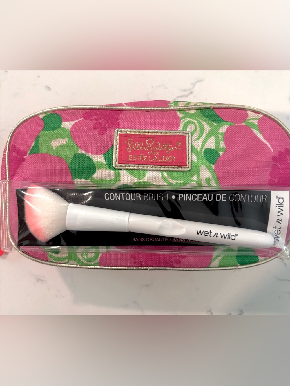 Lilly Pulitzer x Estée Lauder floral pouch with a Wet n wild White Contour Brush